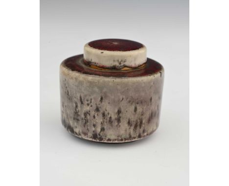 Ruskin Pottery, a High Fired inkwell, 1915, cylindrical drum form with disc lid, the main body with brown speckled grey groun