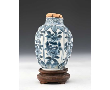 A Chinese blue and white tea caddy or canister, Ming, probably Wanli, relief moulded fluted and lobed shouldered form, each p