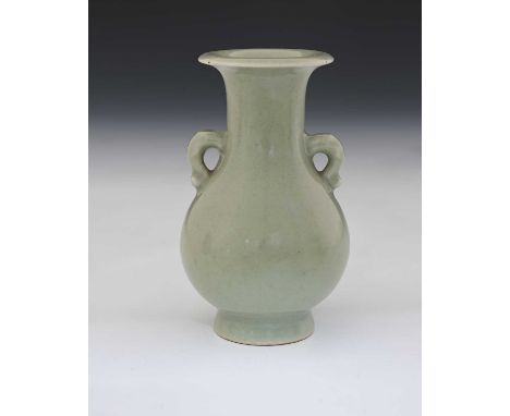 A Chinese celadon glazed vase, Qianlong mark and possibly of the period, twin handled baluster form with everted rim, undergl