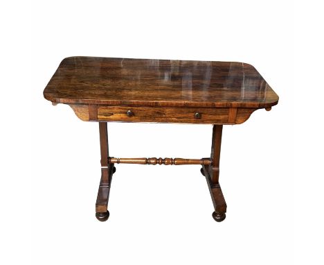 A William IV rosewood sofa table, circa 1830, overhanging top with curved edges, a single frieze drawer with turned pulls, ta