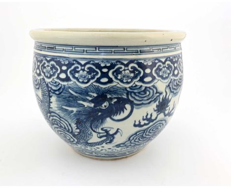 A Chinese blue and white dragon jardiniere, Qianlong style, Qing Dynasty, ovoid form, painted with a pair of wrything four cl