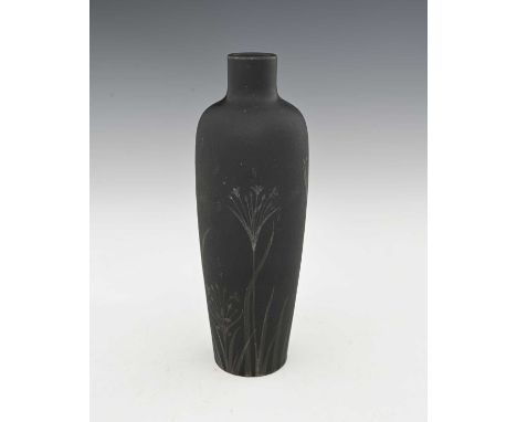 Ruskin Pottery, a black matte glazed vase, 1917, shouldered form, painted with sprigs of wild flowers, silver painted marks, 