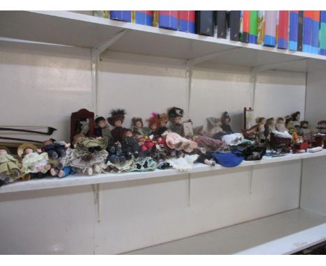 A large assortment of 1/12" scale doll house character dolls and accessories 