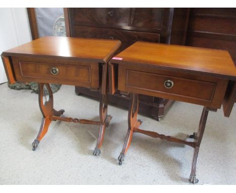 A pair of modern yew wood sofa style tables with inset drawers 