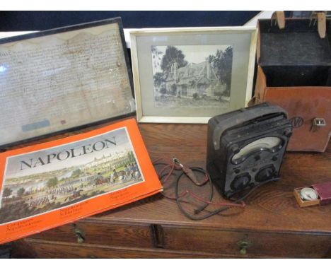 A vintage Universal Avometer in a leather travel case, together with a vintage compass, an indenture, Napoleon prints and a p