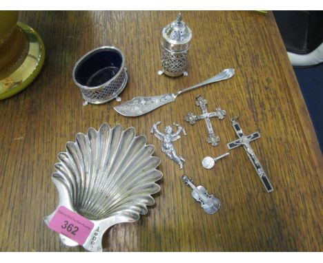 A group of silver items to include a Walker &amp; Hall shelf shaped butter dish, an engraved butter knife, a mustard pot with