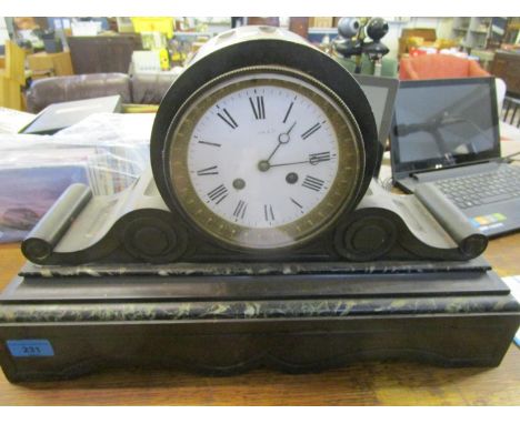 A Victorian black slate and green variegated marble cased mantle clock, with a white enamel Roman dial having moon hands and 