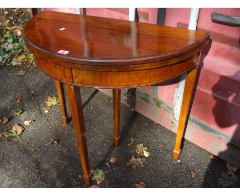 Circa 1900 a Georgian style demi lune card table standing on squared, tapering legs with spade feet, 29" h, 33"w 