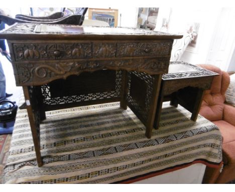 A Chinese carved writing table with chair circa 1900