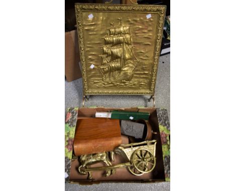 An Arts and Crafts copper tripod bowl, lightly planished, foundry mark, early 20th century; brass fire guard, cast in relief 