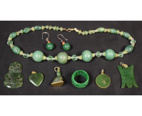 A quantity of jade and jadeite beads, necklaces, earrings, ring, etc.