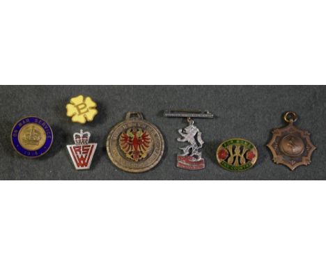 Badges - a First World War enamel and brass badge, On War Service 1914; a Primrose League badge; a Women's Institure enamel b