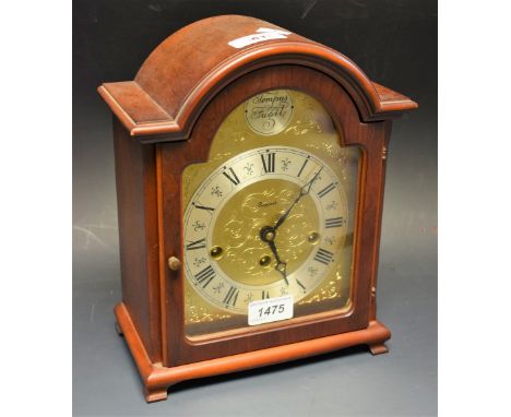 A mahogany cased three keyhole mantel clock