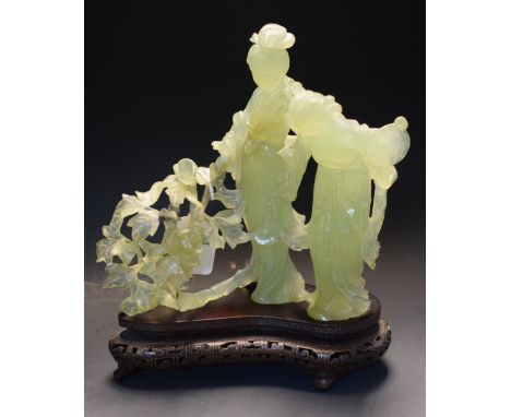 A Chinese jade figure group, carved with two ladies, wearing flowering robes by blossoming branches, pierced hardwood base, 2