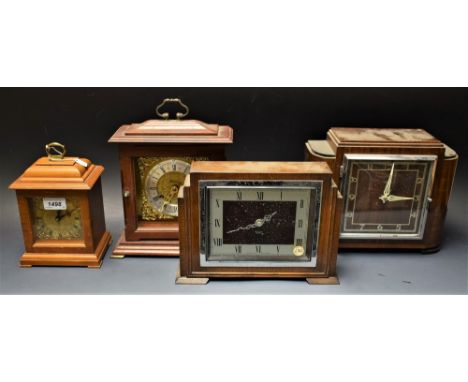 Clocks - a small reproduction oak bracket clock, brass dial, Roman numerals, folding handle;  others Smiths, Metamec etc (4)