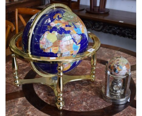 A large modern desk globe; another smaller 