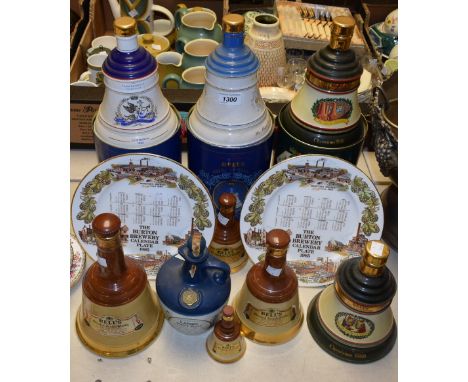 A Bell's whisky decanter; others similar including commemorative; two Burton Brewery plates; etc 