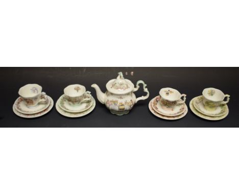 A Royal Doulton Brambly Hedge miniature tea pot, four miniature teacups, saucers and tea plates, transfer printed with the Fo