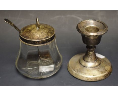 A jam pot with silver top, Birmingham 1912; a hallmarked silver candlestick