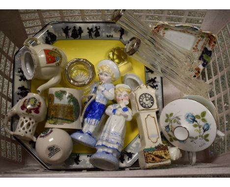 A clear glass smelling salts bottle, silver collar, Birmingham 1915; a pair of continental figures, children in traditional d