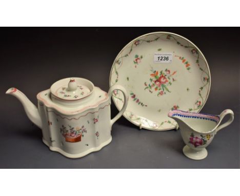 A New Hall commode teapot and cover, painted with basket of flowers and scattered sprigs, below a wavy dotted line, flat cove