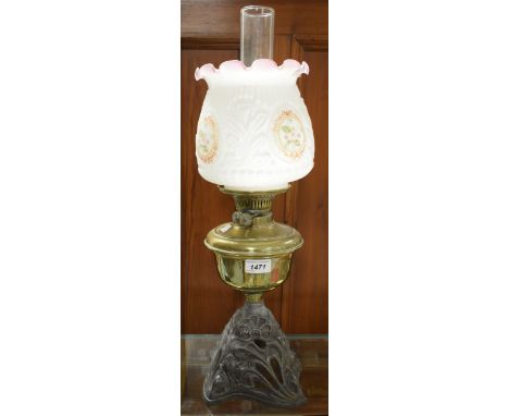A Victorian Art Nouveau cast iron and brass paraffin lamp, floral shade 