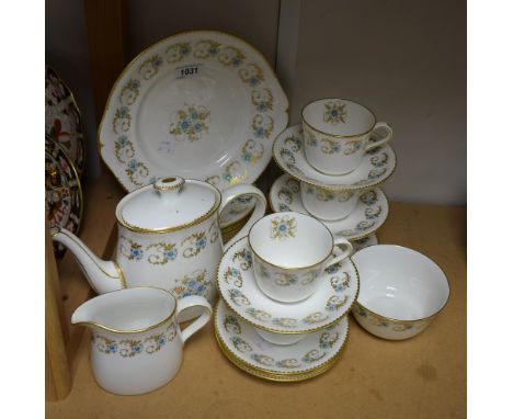 A Royal Crown Derby part tea set, decorated with pale blue flowers among gilded foliage, comprising teapot, cake plate, side 