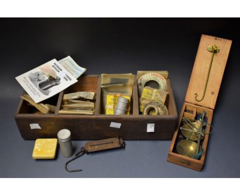A boxed set of apothecary scales; a collection of photographic negatives etc 