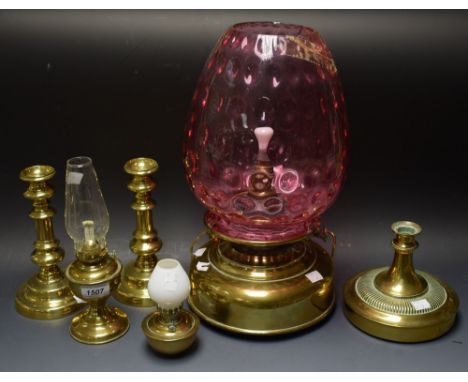 A large brass Helios paraffin lamp later converted to electricity; others, nursery lamp, a pair of candlesticks, etc