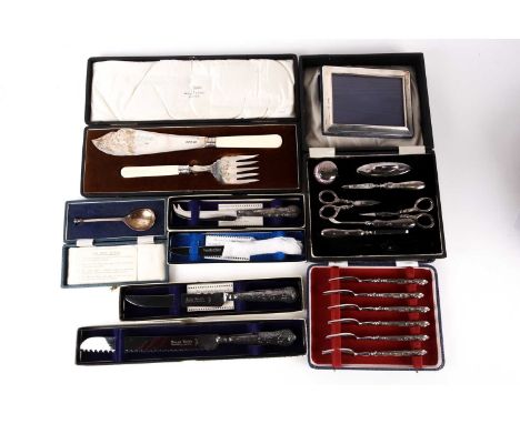 A cased pair of 1930s silver bladed fish servers with engraved decoration Sheffield 1932 by Walker &amp; Hall. Together with 