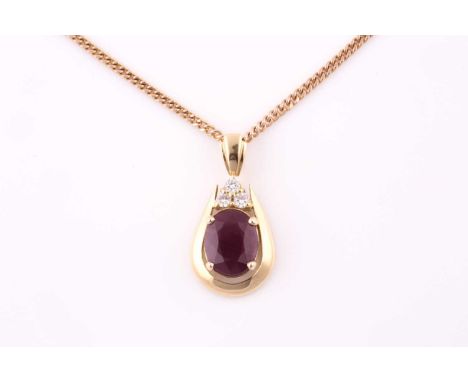 A ruby and diamond pendant, the pinkish-red opaque ruby measuring 12.8 x 10.5 x 3.6mm approximately, diamonds weighing 0.3 ca