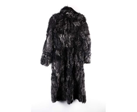 A CoCo Lacour black sheepskin reversable lady's coat with double button fastening (one missing), lacking belt, ankle length, 