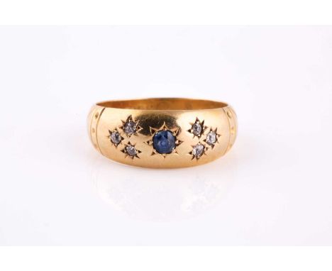 18ct yellow gold, sapphire and diamond ring, court style tapering band gypsy set with a round cut sapphire, with three old cu