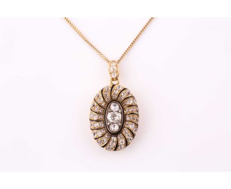 A late 19th century French oval locket/pendant, one side grain set with old mine and old European cut diamonds within black e