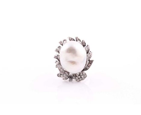 A diamond and pearl cocktail ring, set with a South Sea baroque pearl measuring approximately 18.7 x 15.5 mm, within a stylis