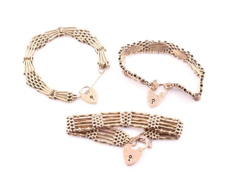 A 9ct yellow gold articulated fancy gate-link bracelet, with heart-shaped clasp, together with two simila 9ct yellow gold gat