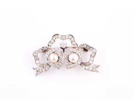 A late 19th / early 20th century diamond and pearl sweetheart brooch, the ribbon surmount and diamond hearts set with old-cut