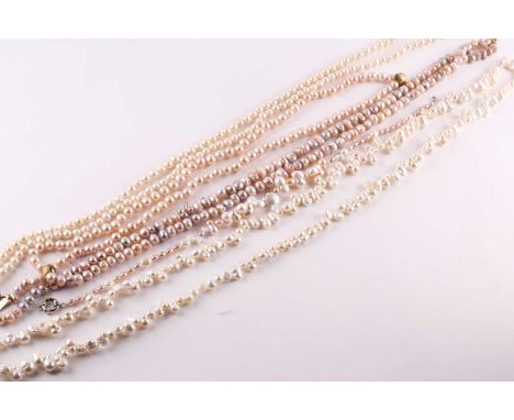 A freshwater baroque pearl necklace, 124cm length; together with a two-row freshwater pearl necklace, two pinky/apricot colou