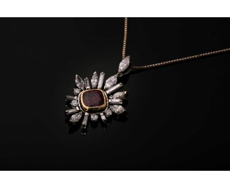 A ruby and diamond pendant, the square mixed cut ruby rubover set in yellow metal with a closed back, surround by marquise cu