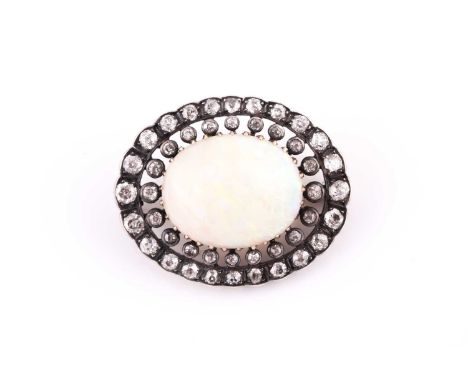 A diamond and opal brooch, of oval design, centred with an oval cabochon opal, showing good play of colour, within a double b