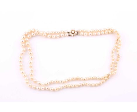 A double strand of cultured pearls with 9ct gold and cultured pearl cluster clasp, comprising of approximately one hundred an