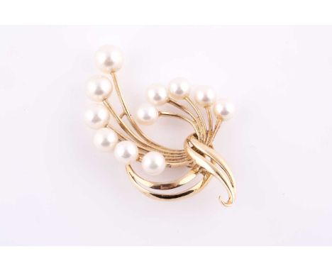 A 14k yellow gold and pearl spray brooch, set with eleven cultured pearls, marked 14K to verso, 5.2 cm long.Condition report: