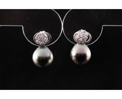 A pair of black South Sea pearl and diamond earrings, each with a floral diamond cluster above a round black pearl, earrings 