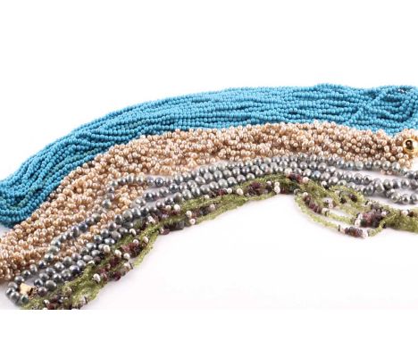 A multi-strand turquoise colour bead necklace to a gilt clasp; a multi-strand café-au-lait freshwater pearl necklace; a five-