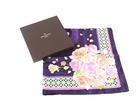 A Patek Phillipe silk scarf with roses and petals on a royal blue ground within a lattice border, the centre with a roundal o