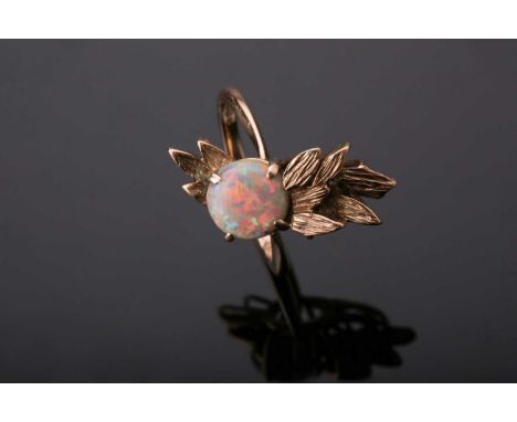 A 9ct yellow gold and opal ring, set with a round cabochon opal, with foliate style mount, size M 1/2, 4.2 grams.