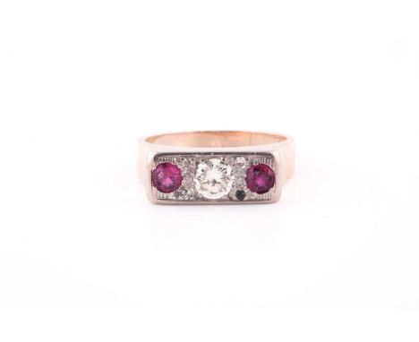 A 9ct yellow gold, diamond and ruby ring, centred with a round-cut diamond of approximately 0.25 carats, flanked with two rou