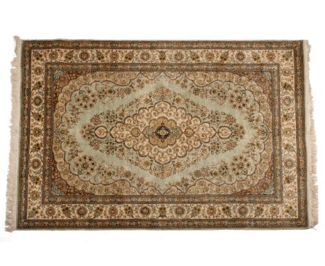 The first a Kashmir style with a shaped central medallion on a pale blue ground with a guarded border; the second with a cent