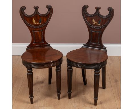 The shaped backs with painted armorial decoration above a round seat, raised on octagonal tapered legs.38cm wide x 85.5cm hig