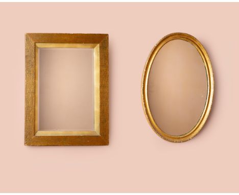 The first an oval mirror with a gilt frame; the second a rectangular mirror with a bevelled plate and a wooden frame.First 50
